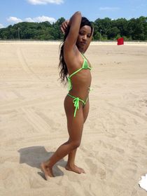 Busty girl in the beach.